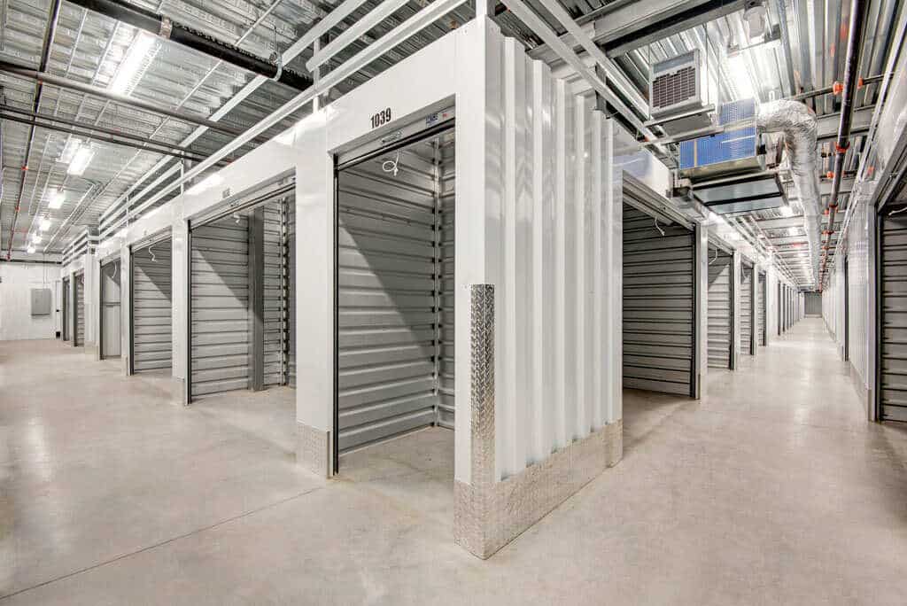 Interior view of a hallway of open storage units.