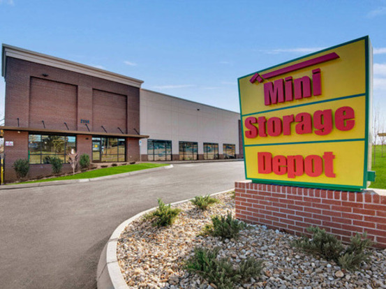 Exterior view of Mini Storage Depot. The building is a clean, modern structure with a prominent Mini Storage Depot sign.